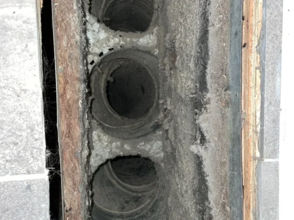 case-air-duct-4-before Duct openings in a wall cavity before cleaning