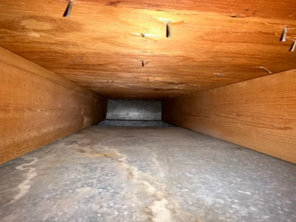 The same air duct after cleaning - bare galvanized surface, no dust left